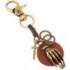 Šperky eshop - Patinovaná kľúčenka v mosadznej farbe, kruh z umelej kože s rukou, kruhy, kríž Z36.10 Šperky eshop - Patinovaná kľúčenka v mosadznej farbe, kruh z umelej kože s rukou, kruhy, kríž Z36.10
