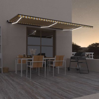 VidaXL Ručně zatahovací markýza s LED světlem 600 x 350 cm žlutobílá – Zboží Mobilmania