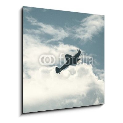 Obraz 1D - 50 x 50 cm - Fighter plane on cloudy sky Bojové letadlo na zatažené obloze