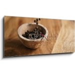 Obraz s hodinami 1D panorama - 120 x 50 cm - black dry pepper fall into wooden bowl on table Černý suchý pepř spadl do dřevěné misky na stole – Hledejceny.cz