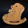 Dřevěná hračka Amadea puzzle houpací medvěd masivní dřevo dvou druhů