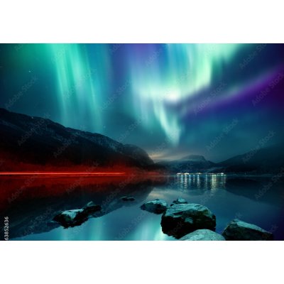 WEBLUX 163852636 Fototapeta papír A large Northern Lights (aurora borealis) display glowing over a mountain pass and reflected on a lake at night. Photo composition. rozměry 184 x 128 cm – Hledejceny.cz