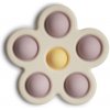 Mushie silikonová hračka pop-it Flower Soft-lilac-pale-daffodil