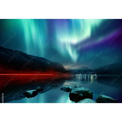 WEBLUX 163852636 Fototapeta plátno A large Northern Lights (aurora borealis) display glowing over a mountain pass and reflected on a lake at night. Photo composition. rozměry 174 x 120 cm – Hledejceny.cz