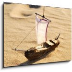 Obraz 1D - 100 x 70 cm - wooden sail ship toy model in the sea sand dřevěná plachetnice model hračky v mořském písku – Zboží Mobilmania