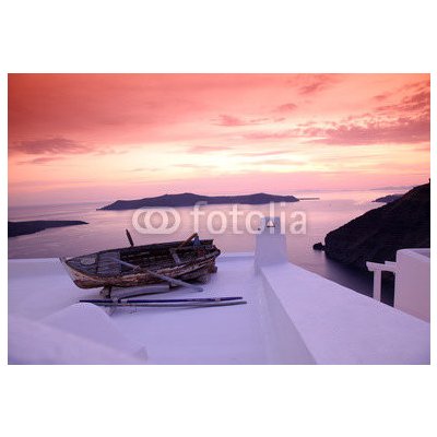 WEBLUX 41448704 Samolepka fólie Santorini with boat on white roof against sunset in Greece Santorini s lodí na bílé střeše proti západu slunce v Řecku rozměry 145 x 100 cm – Zboží Mobilmania