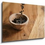 Skleněný obraz 1D - 100 x 70 cm - black dry pepper fall into wooden bowl on table Černý suchý pepř spadl do dřevěné misky na stole – Hledejceny.cz