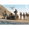 Tapety WEBLUX 164038449 Fototapeta vliesová Soldiers are Using Drone for Scouting During Military Operation in the Desert. Vojáci používají dron ke skautingu během vojenské op rozměry 145 x 100 cm