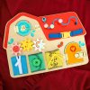 Dřevěná hračka Tooky Toys Activity Board Domeček 8v1