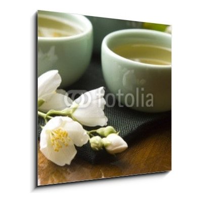 Skleněný obraz 1D - 50 x 50 cm - Green tea with jasmine in cup and teapot on wooden table Zelený čaj s jasmínem v šálku a konvici na dřevěném stole – Zbozi.Blesk.cz