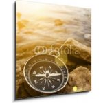 Skleněný obraz 1D - 50 x 50 cm - compass on the shore at sunrise kompas na pobřeží při východu slunce