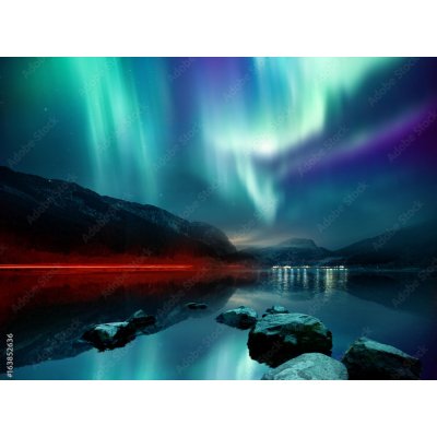 WEBLUX 163852636 Fototapeta plátno A large Northern Lights (aurora borealis) display glowing over a mountain pass and reflected on a lake at night. Photo composition. rozměry 330 x 244 cm – Hledejceny.cz