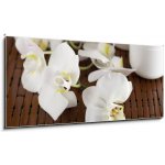 Obraz 1D panorama - 120 x 50 cm - Face cream and white orchid on a bamboo mate Krém na obličej a bílá orchidej na bambusové kamarádce – Hledejceny.cz