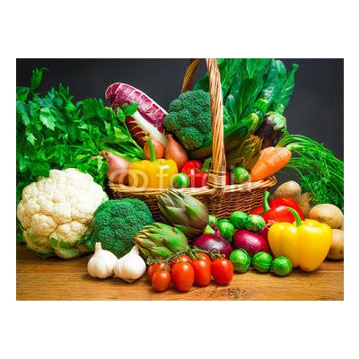 WEBLUX 61518085 Fototapeta vliesová Raw vegetables in wicker basket on wooden table Surové zeleniny v proutěném koši na dřevěném stole rozměry 270 x 200 cm