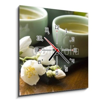 Obraz s hodinami 1D - 50 x 50 cm - Green tea with jasmine in cup and teapot on wooden table Zelený čaj s jasmínem v šálku a konvici na dřevěném stole – Zboží Mobilmania