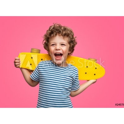 WEBLUX 245786759 Fototapeta vliesová Happy curly boy laughing and holding skateboard Šťastný kudrnatý chlapec se směje a drží skateboard rozměry 270 x 200 cm – Zboží Mobilmania