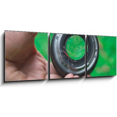 Obraz s hodinami 3D třídílný - 150 x 50 cm - Mobile lenses on a green lawn. Mobilní čočky na zeleném trávníku. – Zboží Mobilmania