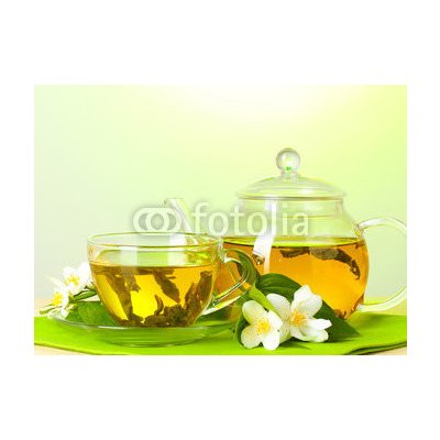 WEBLUX 42216193 Fototapeta plátno tea with jasmine in cup and teapot on table on green background čaj s jasmínem v šálku a čajová konvice na stole na zeleném pozadí rozměry 160 x 116 cm – Zbozi.Blesk.cz