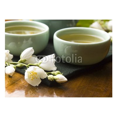 WEBLUX 42047983 Fototapeta plátno Green tea with jasmine in cup and teapot on wooden table Zelený čaj s jasmínem v šálku a konvici na dřevěném stole rozměry 160 x 116 cm – Zbozi.Blesk.cz