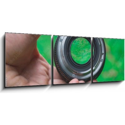 Obraz 3D třídílný - 150 x 50 cm - Mobile lenses on a green lawn. Mobilní čočky na zeleném trávníku. – Zboží Mobilmania