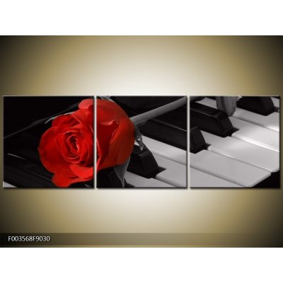 Obraz červená růže na klavíru