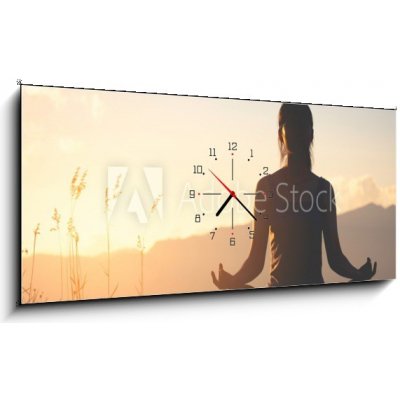 Obraz s hodinami 1D panorama - 120 x 50 cm - silhouette fitness girl practicing yoga on mountain silueta fitness dívka cvičí jógu na hoře – Zbozi.Blesk.cz