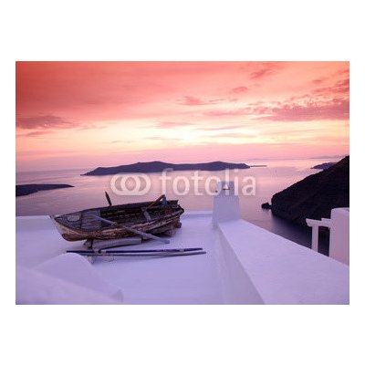 WEBLUX 41448704 Samolepka fólie Santorini with boat on white roof against sunset in Greece Santorini s lodí na bílé střeše proti západu slunce v Řecku rozměry 100 x 73 cm – Zboží Mobilmania