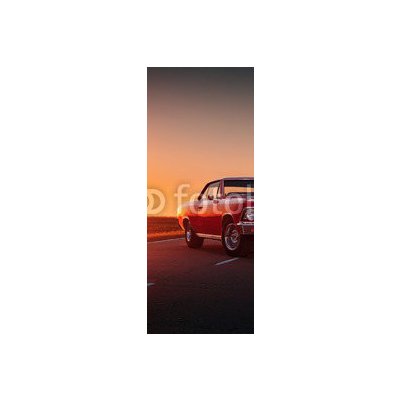 WEBLUX 109817494 Samolepka na lednici fólie Retro red car standing on asphalt road at sunset Retro červené auto stojí na asfaltové cestě při západu slunce rozměry 80 x 200 cm – Zbozi.Blesk.cz