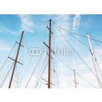 WEBLUX 166856176 Fototapeta vliesová Masts of sailboat and blue sky Stožáry plachetnice a modré oblohy rozměry 100 x 73 cm – Zboží Mobilmania