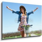 Skleněný obraz 1D - 100 x 70 cm - Beautiful young woman with a vintage bike in the field. Krásná mladá žena s vintage kolo v poli. – Hledejceny.cz