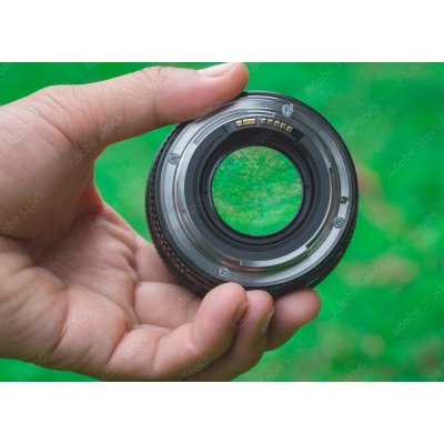WEBLUX 88270999 Samolepka fólie Mobile lenses on a green lawn. Mobilní čočky na zeleném trávníku. rozměry 200 x 144 cm