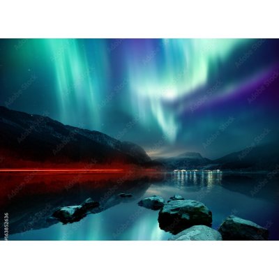 WEBLUX 163852636 Fototapeta plátno A large Northern Lights (aurora borealis) display glowing over a mountain pass and reflected on a lake at night. Photo composition. rozměry 160 x 116 cm – Hledejceny.cz