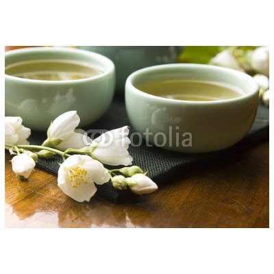 WEBLUX 42047983 Fototapeta plátno Green tea with jasmine in cup and teapot on wooden table Zelený čaj s jasmínem v šálku a konvici na dřevěném stole rozměry 174 x 120 cm – Zbozi.Blesk.cz