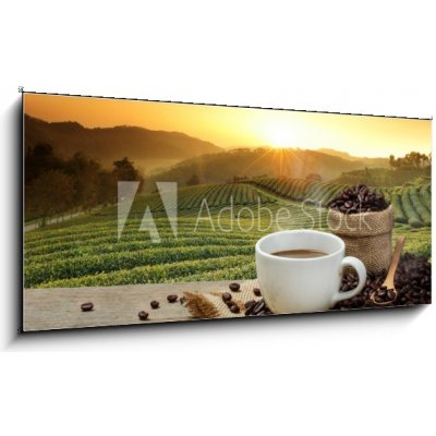 Obraz 1D panorama - 120 x 50 cm - Hot Coffee cup with Coffee beans on the wooden table and the pla Horký šálek kávy s kávová zrna na dřevěný stůl a pla – Hledejceny.cz