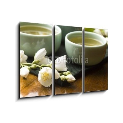 Obraz 3D třídílný - 105 x 70 cm - Green tea with jasmine in cup and teapot on wooden table Zelený čaj s jasmínem v šálku a konvici na dřevěném stole – Zbozi.Blesk.cz