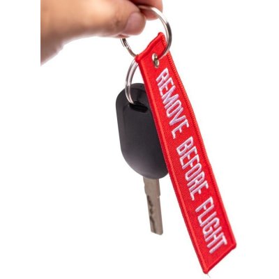 Přívěsek na klíče remove before flight červená menší – Zboží Mobilmania