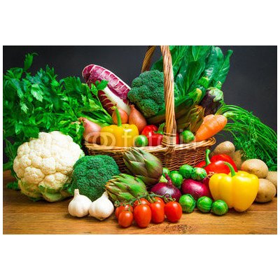 WEBLUX 61518085 Fototapeta vliesová Raw vegetables in wicker basket on wooden table Surové zeleniny v proutěném koši na dřevěném stole rozměry 145 x 100 cm
