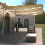 VidaXL Ručně zatahovací markýza s LED světlem 600 x 350 cm žlutobílá – Zboží Mobilmania