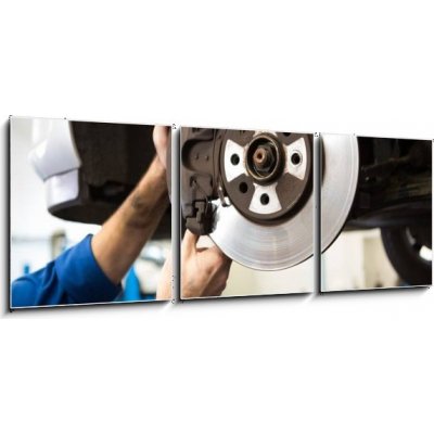 Obraz 3D třídílný - 150 x 50 cm - Focused mechanic adjusting the wheel Zaměřený mechanik nastaví kolo – Zbozi.Blesk.cz