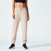 DOMYOS Dámske fitness tepláky 500 Essentials rovné svetlobéžové XS W26 L30