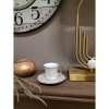 Porcelánová šálka s tanierikom v bielom farebnom prevedení so zlatým dekorovaním 95 ml Clayre & Eef 43871
