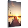 Vertikálny foto obraz na plátne Západ slnka mólo 50x100 cm