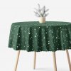 Goldea vianočný okrúhly teflónový obrus - hviezdičky na zelenej Ø 160 cm