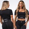 NEBBIA - Tvarujúci bezšvový crop top FLOW SEAMLESS 499 (black) - L