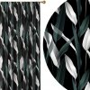 HomeView Zatemňovací záves Abstract Leaves – čierny podklad, zeleno-biele listy v modernom dizajne Veľkosť: 140x230 na riasiaci pás