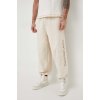 Bavlnené tepláky Calvin Klein Jeans béžová farba,s nášivkou,J30J324953 M
