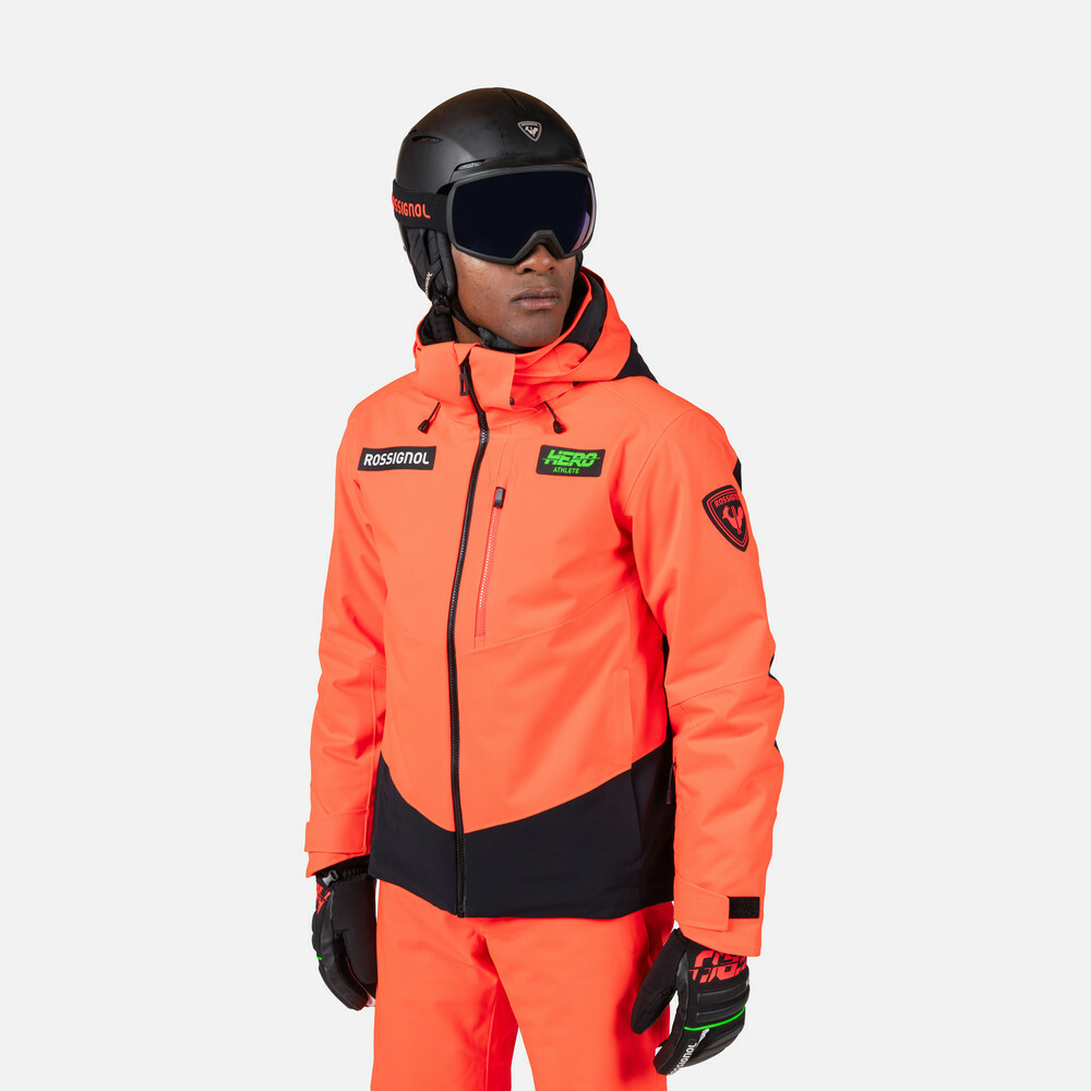 Rossignol HERO BLACKSIDE PUFFY v žiarivom neon červenom – štýlová a funkčná lyžiarska bunda pre maximálny komfort na svahu.