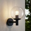 Lindby Vonkajšie nástenné svietidlo Dangan, čierne/čisté, sklo, Ø 20 cm - 10036364