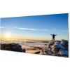 Obraz plexi Mountain muž mraky východ 100x50 cm