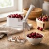 TESCOMA Handy biela - plastiková odšťavovačka na čerešne a višne